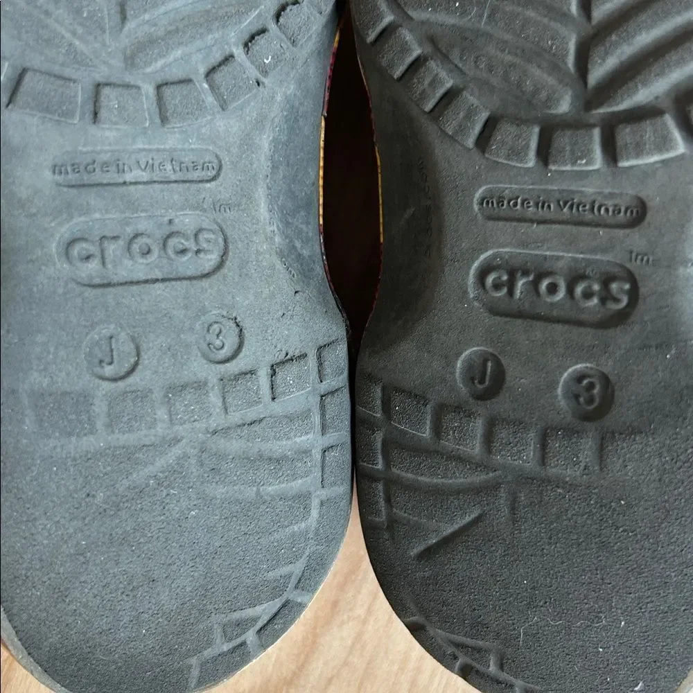 CROCS Kids Black Shoes with Lion and Shield Accents
